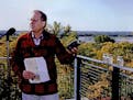 In 1992, Gov. Arne Carlson announced an effort to to clean up the Minnesota River. Carlson held a sample of dirty river water collected after a heavy 