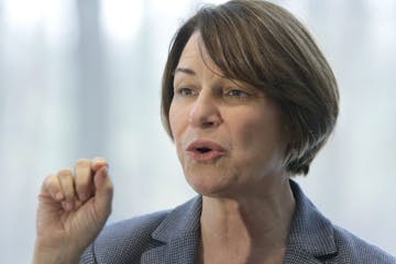 U.S. Sen. Amy Klobuchar has seen some criticism of her tough record as a Hennepin County prosecutor. Above: Klobuchar spoke to voters at a campaign st