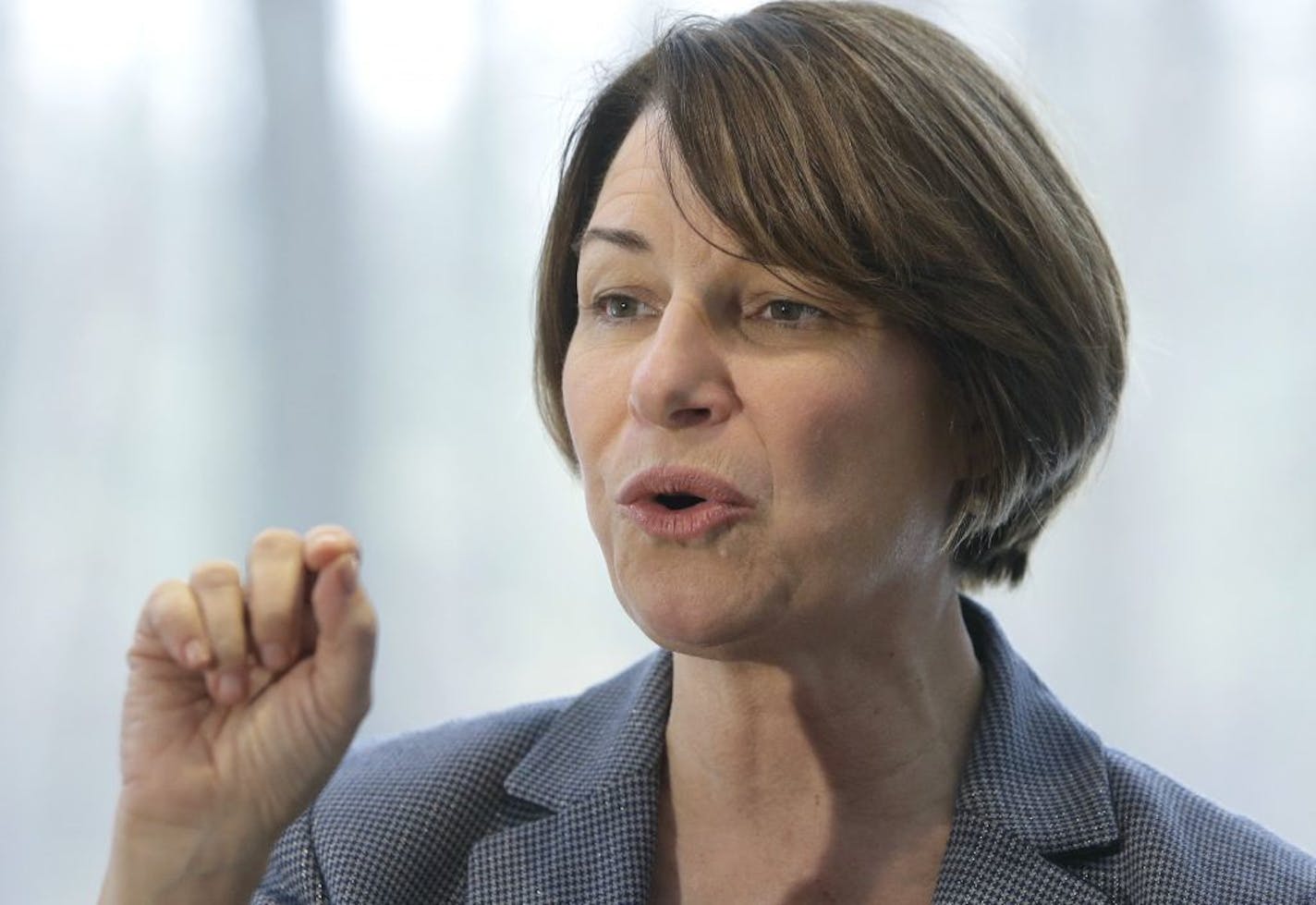 U.S. Sen. Amy Klobuchar has seen some criticism of her tough record as a Hennepin County prosecutor. Above: Klobuchar spoke to voters at a campaign stop at a home, in Nashua, N.H. on Sunday, Feb. 24.