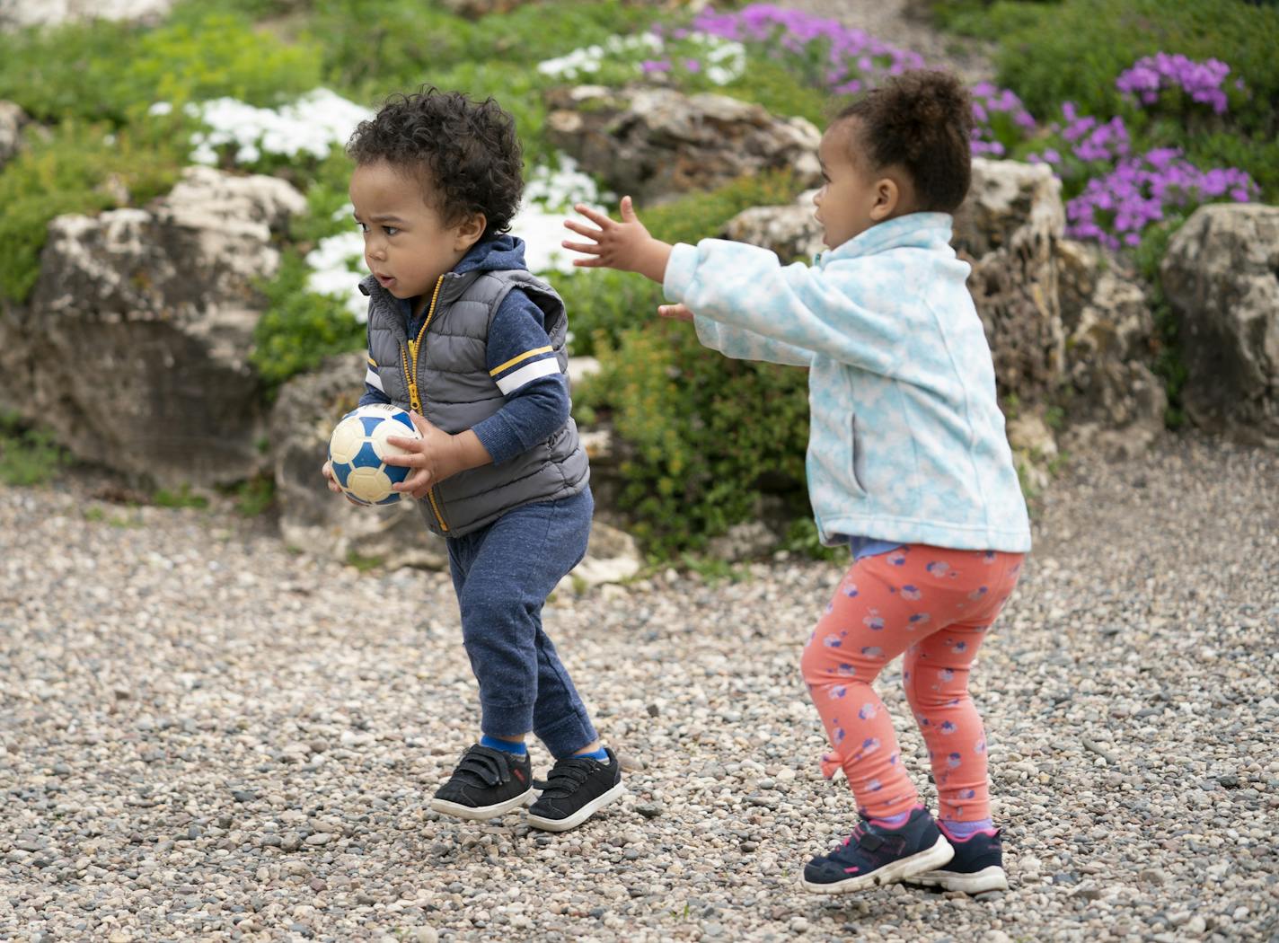 Nadya Jelinek , 2, chased Esai Hodge, 17 months, as they played with a ball at the Peace Garden with their moms in Minneapolis, Minn., on Tuesday, May 21, 2019. ] RENEE JONES SCHNEIDER &#xa5; renee.jones@startribune.com