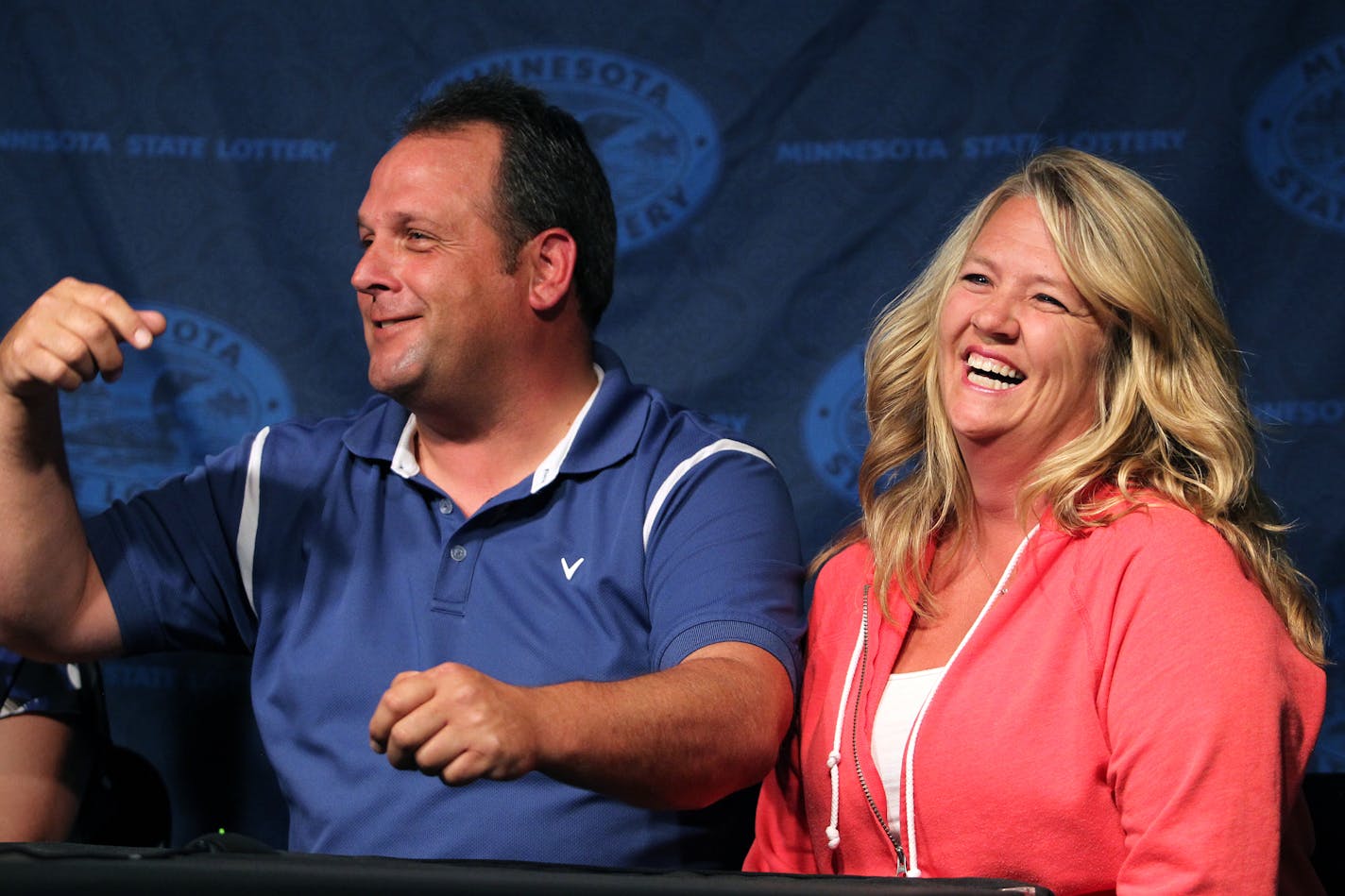 Paul White, of Ham Lake, and Kim VanReese talk about winning a $149.4 million Powerball jackpot at the Minnesota State Lottery office in Roseville on Thursday.