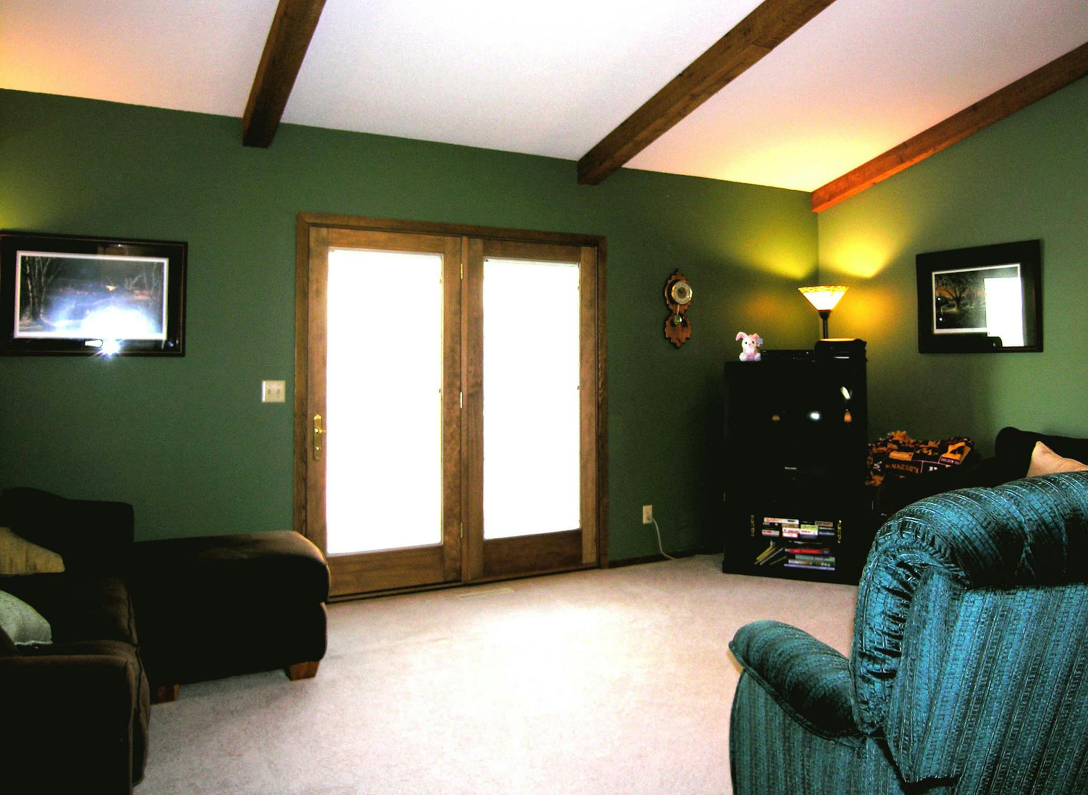 Before: The room was dark and had awkward furniture placement.