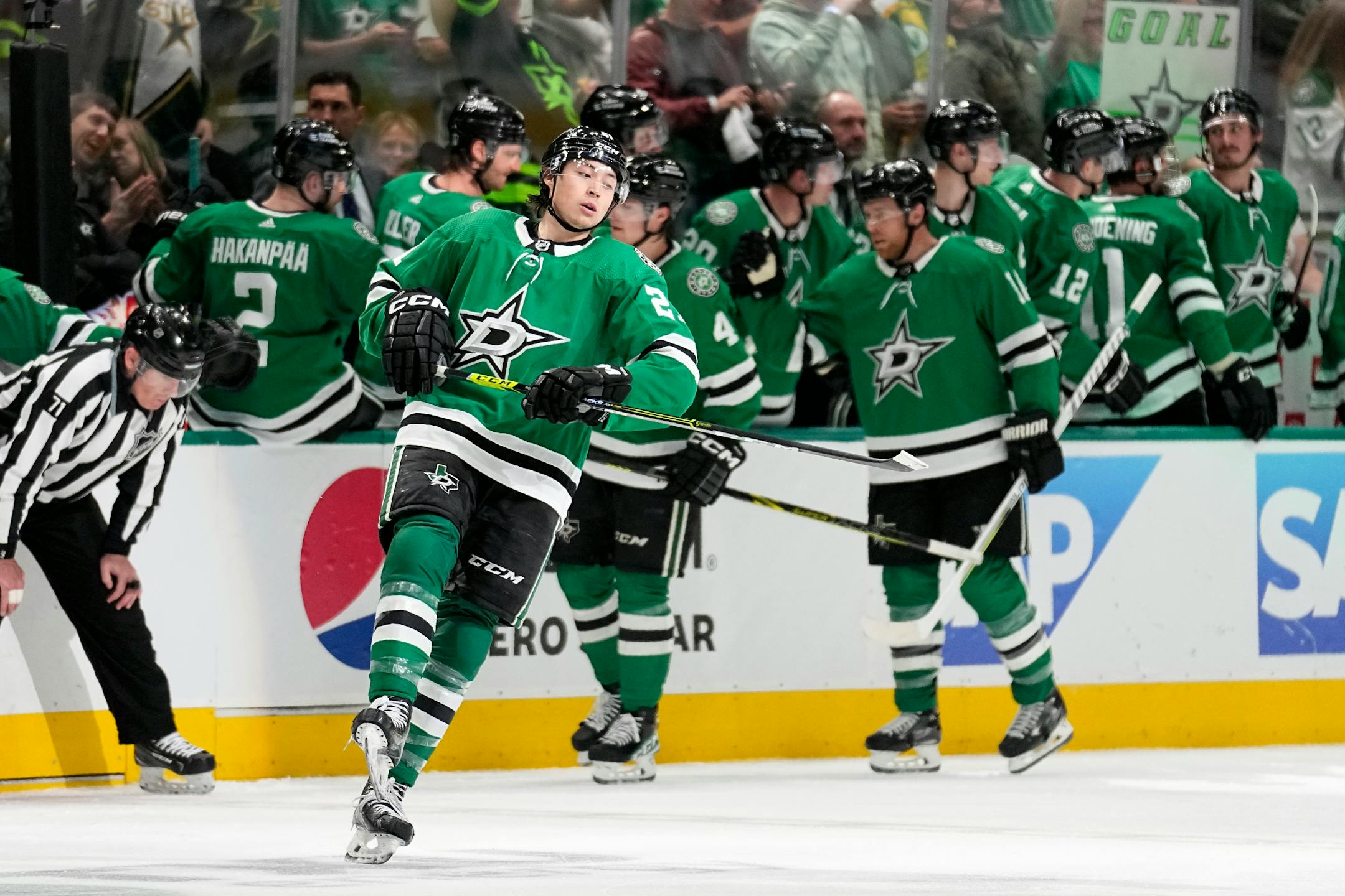 Dallas Stars' Jason Robertson, front, celebrates after scoring against the Minnesota Wild in the second period of Game 1.