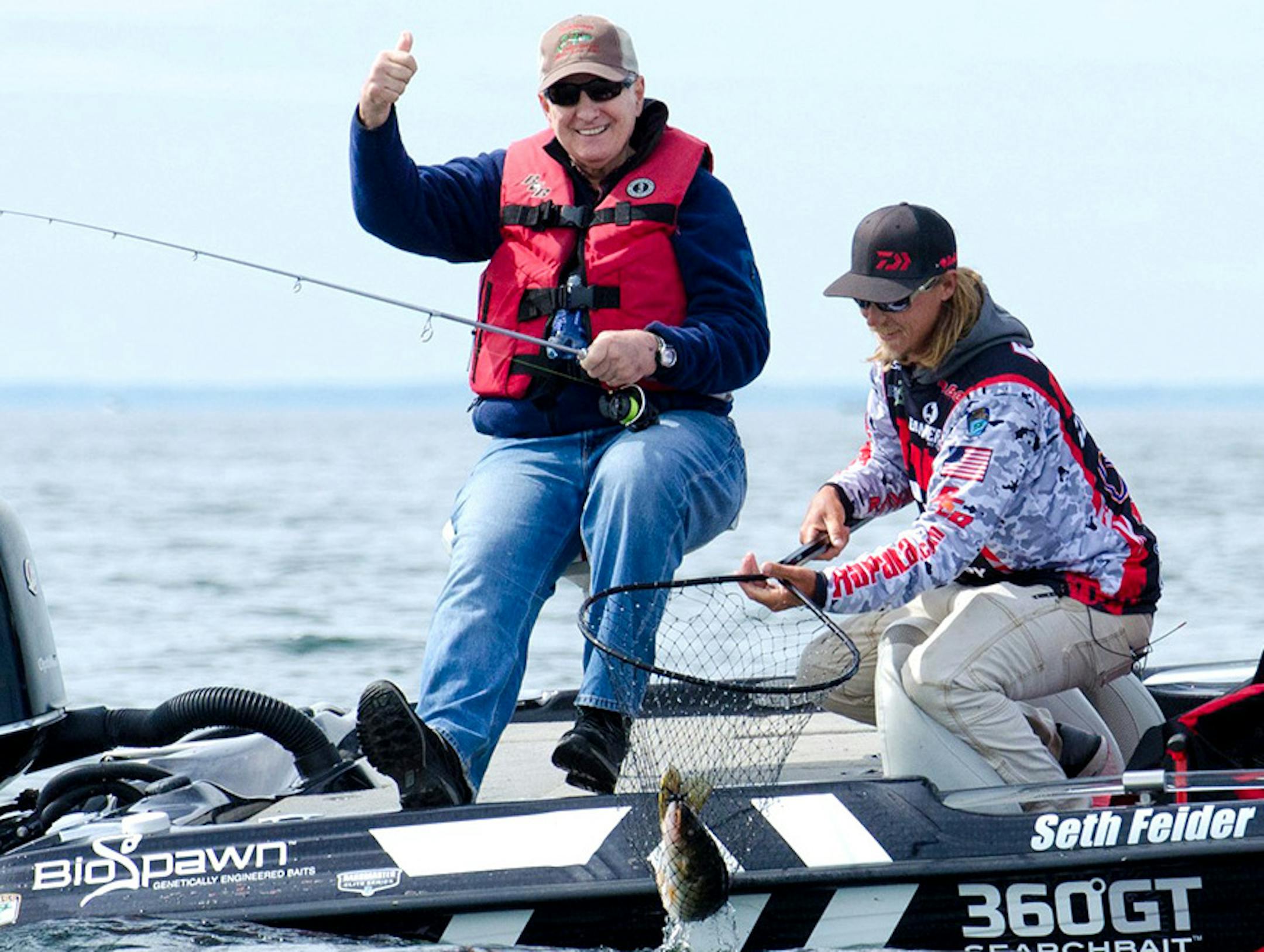 Gov. Mark Dayton celebrated Saturday's opening day of the Minnesota bass fishing season by hooking a 4- to 5-pound walleye during an outing with Bassmaster Elite Series professional Seth Feider, right. Not pictured but also in the fishing party was outdoords storyteller Ron Schara.