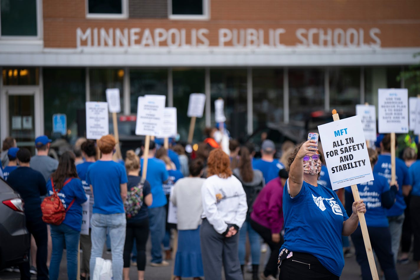 Perhaps 200 Minneapolis Public Schools teachers and staff and members of the Minneapolis Federation of Teachers listened to speakers while they picketed outside district headquarters before the Board of Education's regular monthly meeting Tuesday night. Among them was Veann Beutler, who teaches language arts at Northeast Middle School. ] JEFF WHEELER • Jeff.Wheeler@startribune.com