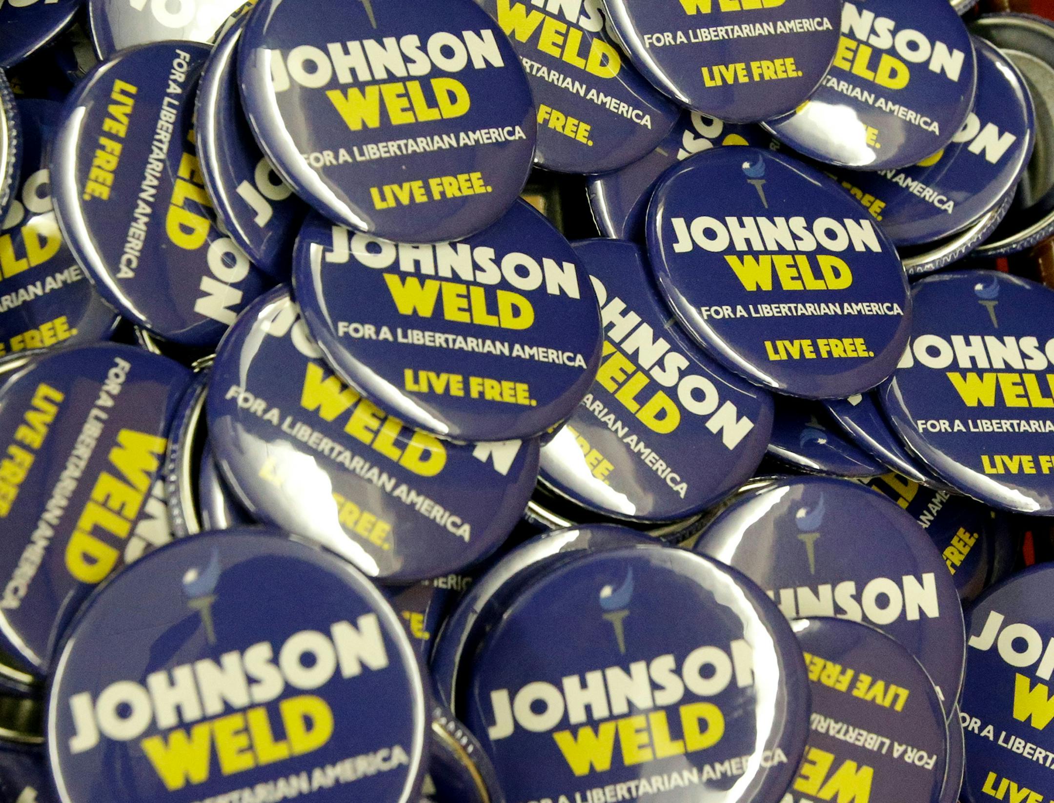 Campaign buttons for Libertarian presidential candidate Gary Johnson and vice presidential candidate Bill Weld at the National Libertarian Party Convention, Friday, May 27, 2016, in Orlando, Fla. (AP Photo/John Raoux) ORG XMIT: FLJR1