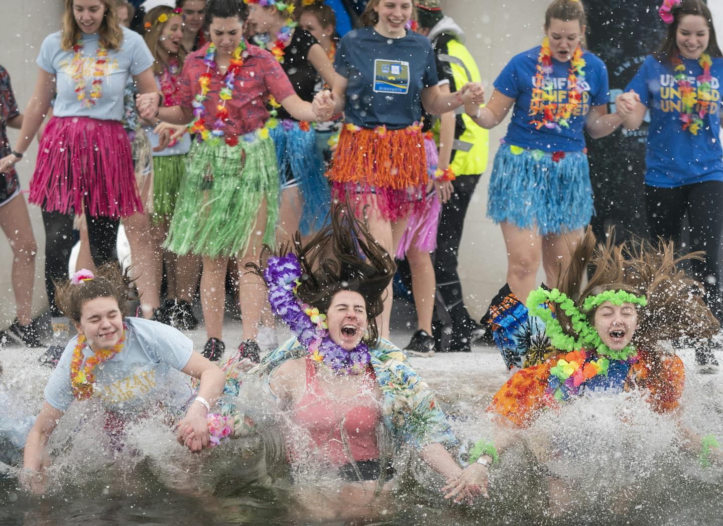 Students from Wayzata High School participate in the Cool School Plunge, part of the Minneapolis Polar Plunge's Frozen Friday events at Thomas Beach on Bde Maka Ska in Minneapolis. ORG XMIT: MIN1903011406024533