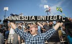 David Martin, of Prior Lake, held up his Minnesota United FC scarf during a match. Minnesota United's future in Major League Soccer, on hold in the wa