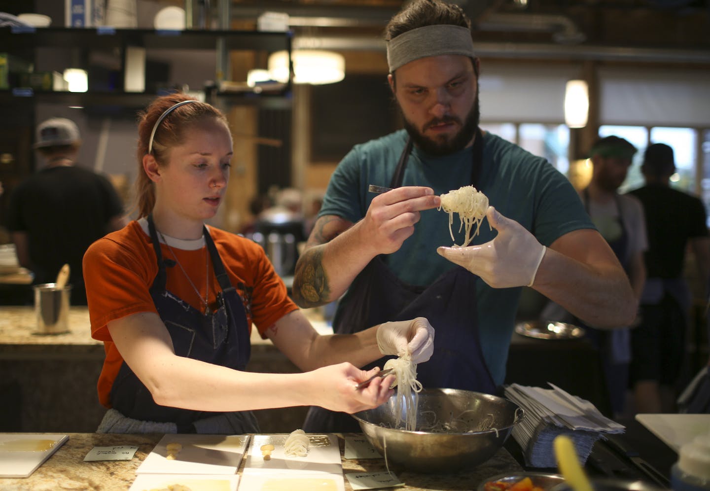 Maddie Wilson and Nathaniel Moser each used tweezers as they plated a course Wednesday night at Travail. ] JEFF WHEELER &#xef; jeff.wheeler@startribune.com Restaurant owners across the Twin Cities say they can't find enough cooks. The state's workforce has dropped by about 30,000 in the past three months, exposing the state's tight labor supply. At Travail in Robbinsdale, the owner/chefs can't do all the cooking themselves to they hire cooks to help them. They're currently down three cooks. The