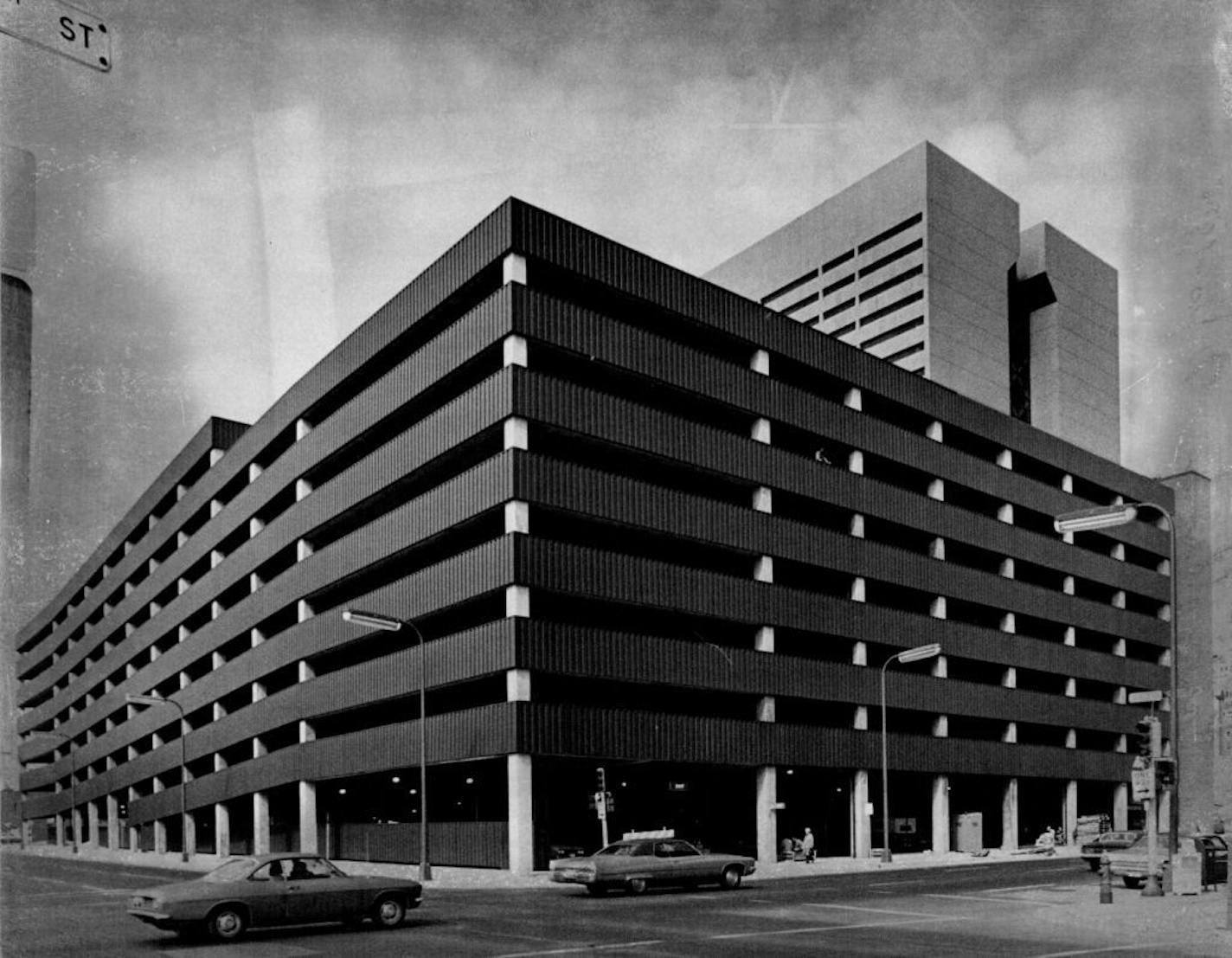 June 20, 1974 Center Ramp Opens -- The Hennepin County Government Center parking ramp, 5th St. and 5th Av. S., opened for business this week. It will provide parking for employees and visitors to the new Government Center (background) and city hall (not shown) across the street. The $2.7-million, block-long structure, has space for 1,217 cars. June 17, 1974 Larry Schreiber, Minneapolis Star Tribune