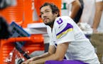 Vikings quarterback Sam Bradford watched from the bench against the Detroit Lions during a Thanksgiving Day loss.