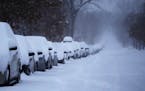 Snow-covered vehicles stacked up during the third consecutive day of snowfall on Feb. 23, 2023 in Minneapolis.



DAVID JOLES • david.joles@startrib