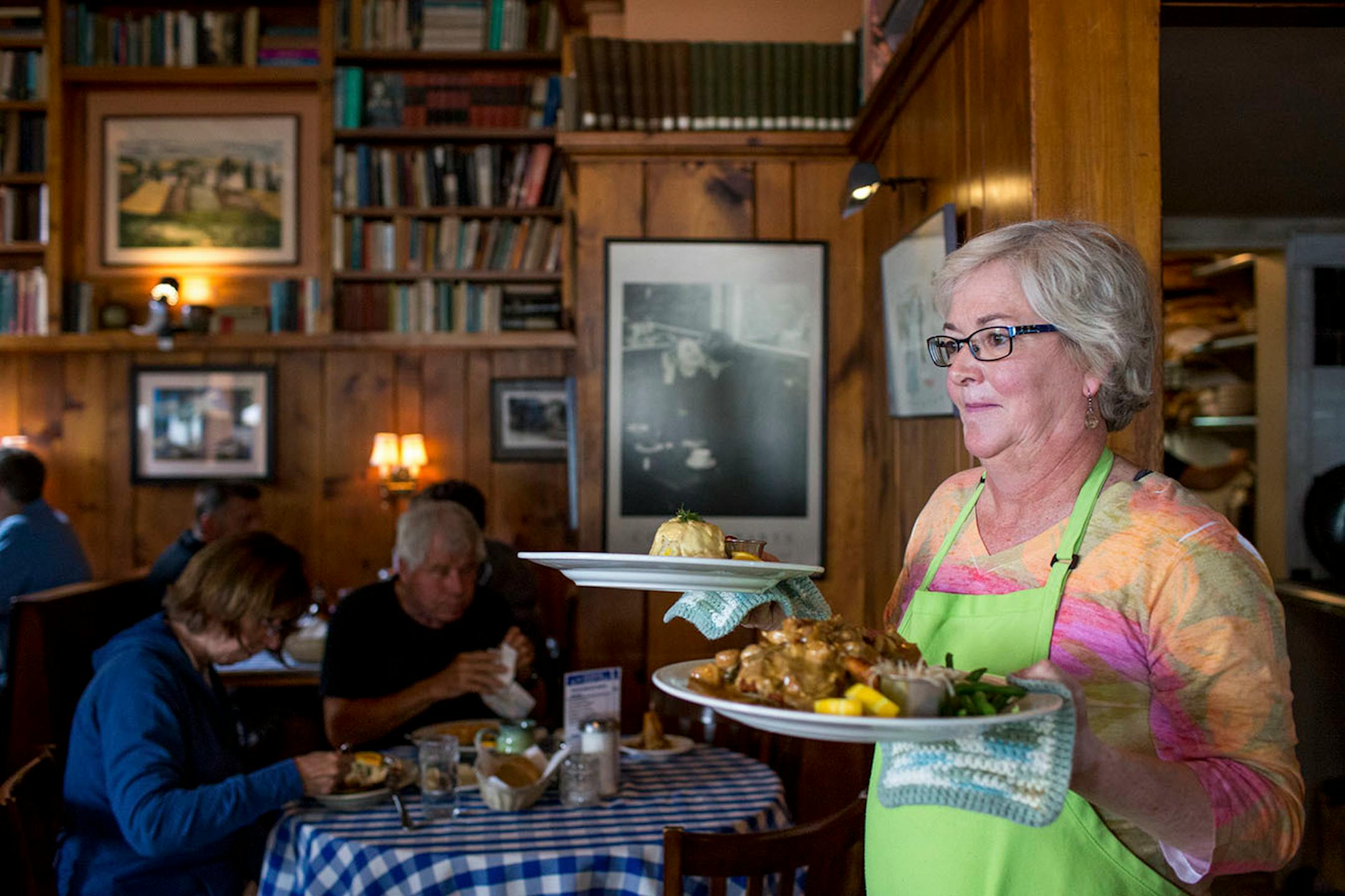 Ann Norton takes food to tables during lunch at Harbor View Cafe in Pepin. ] COURTNEY PEDROZA • courtney.pedroza@startribune.com June 22-24, 2017; Wisconsin restaurants, cafes, bars, bakeries and breweries; Dining along the Mississippi River.