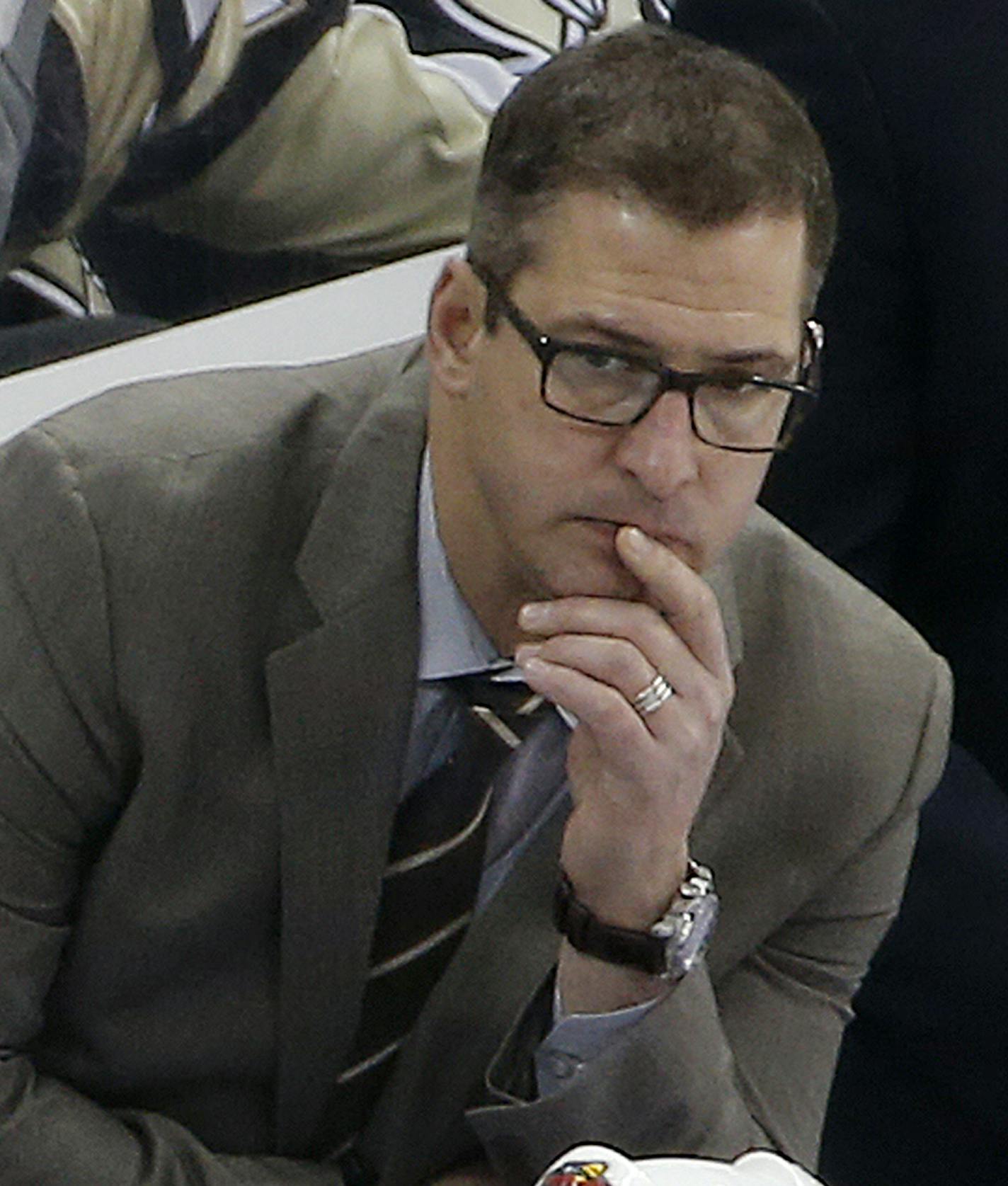 FILE- In this Jan. 13, 2015, file photo, Minnesota Wild assistant coach Darryl Sydor, shown during an NHL hockey game in Pittsburgh, has been charged with drunken driving after being arrested while taking his 12-year-old son to a hockey game. He has been an assistant coach for the past four seasons and also played 18 seasons in the NHL. (AP Photo/Gene J. Puskar,File)