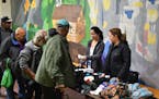 Volunteers for the nonprofit The Joy of Sox hand out new socks to those experiencing homelessness at St. John's Hospice in Philadelphia in 2018. (The 