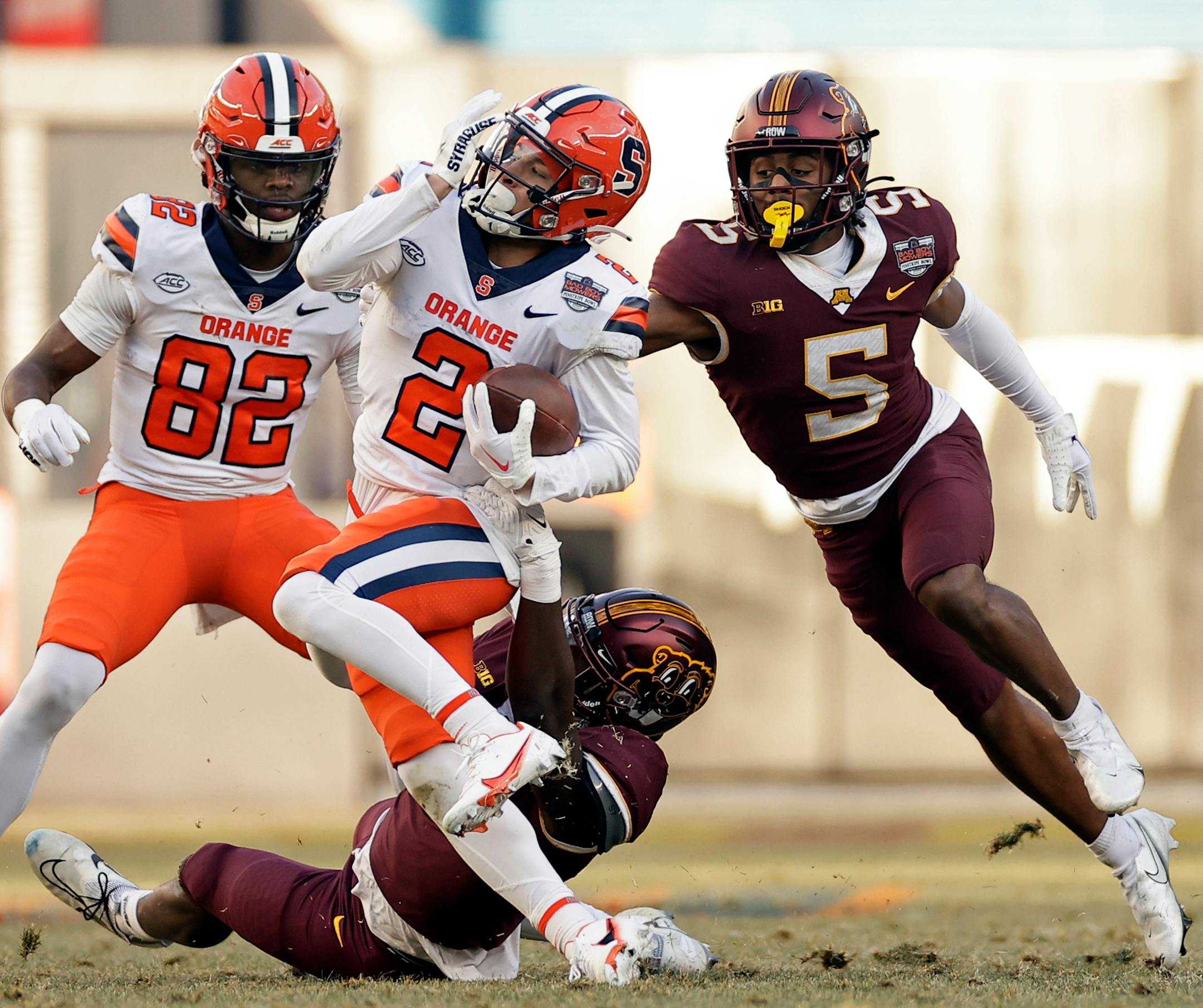 Syracuse wide receiver Trebor Pena (2) is tackled in front of Minnesota defensive back Justin Walley (5) during the first half.
