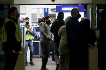 Black Friday shoppers file into Best Buy for the electronics retailer's early 5 a.m. opening Friday in Richfield.