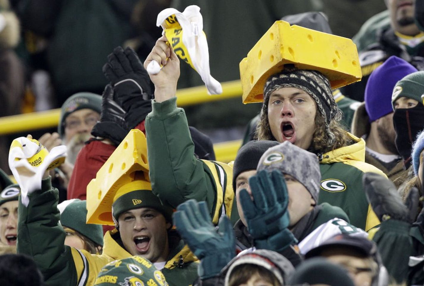 Green Bay Packers fans watch during the first half of an NFL wild card playoff football game between the Packers and the Minnesota Vikings Saturday, Jan. 5, 2013, in Green Bay, Wis.