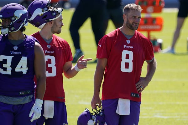Minnesota Vikings quarterback Kirk Cousins (8) watched his teammates during the first day of mandatory minicamp Tuesday in Eagan. ] ANTHONY SOUFFLE �