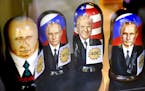Russian Matryoshka dolls depicting Russian President Vladimir Putin and U.S. President Donald Trump are on sale in the Ruslania book store in Central 