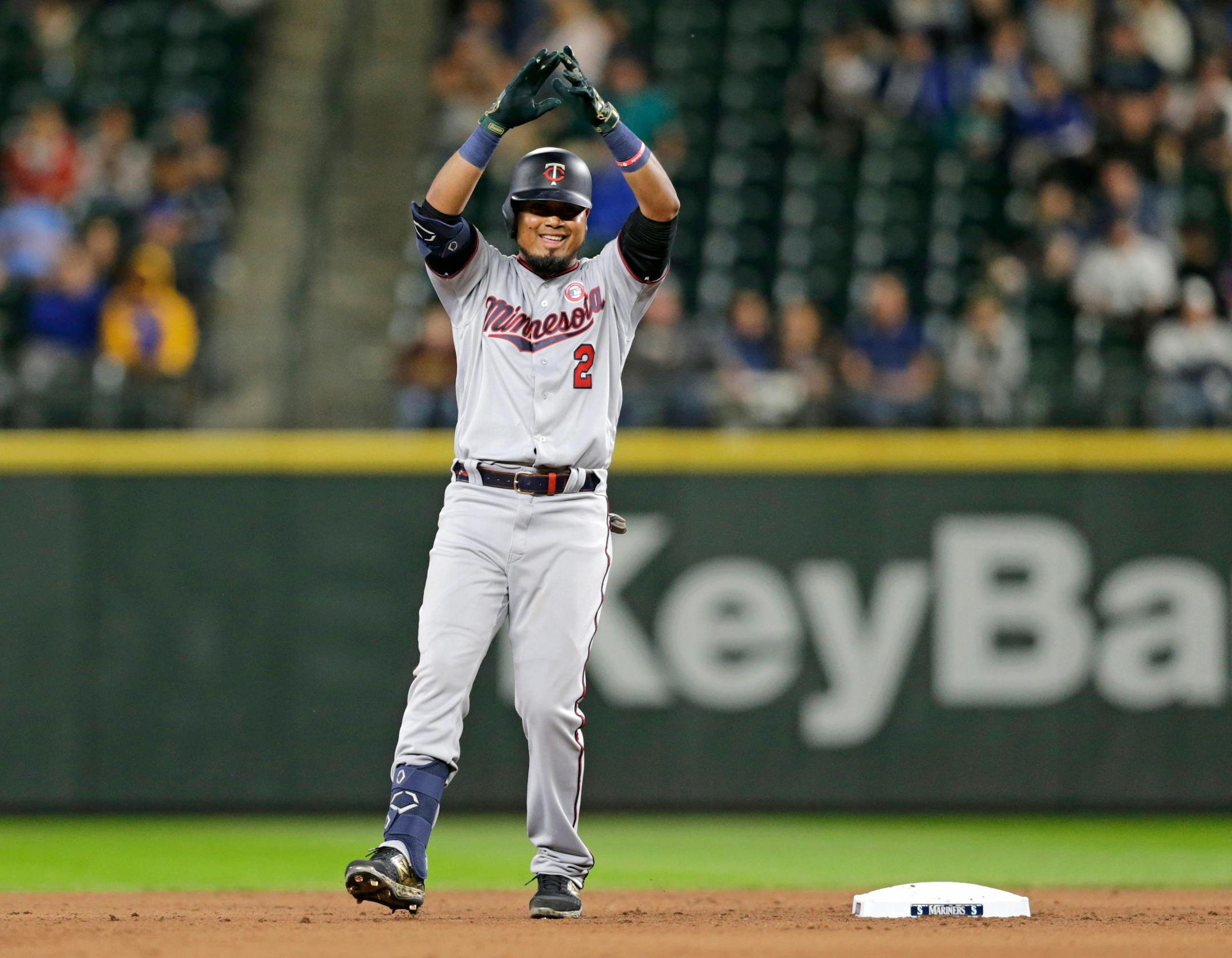 The Twins' Luis Arraez stood next to second base as he celebrated his double against the Mariners -- his first hit in the majors -- during the eighth inning Saturday.
