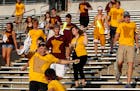 Minnesota Gophers fans scrambled to get the best seats in the student section after the doors opened at TCF Bank Stadium for Thursday night's game vs.
