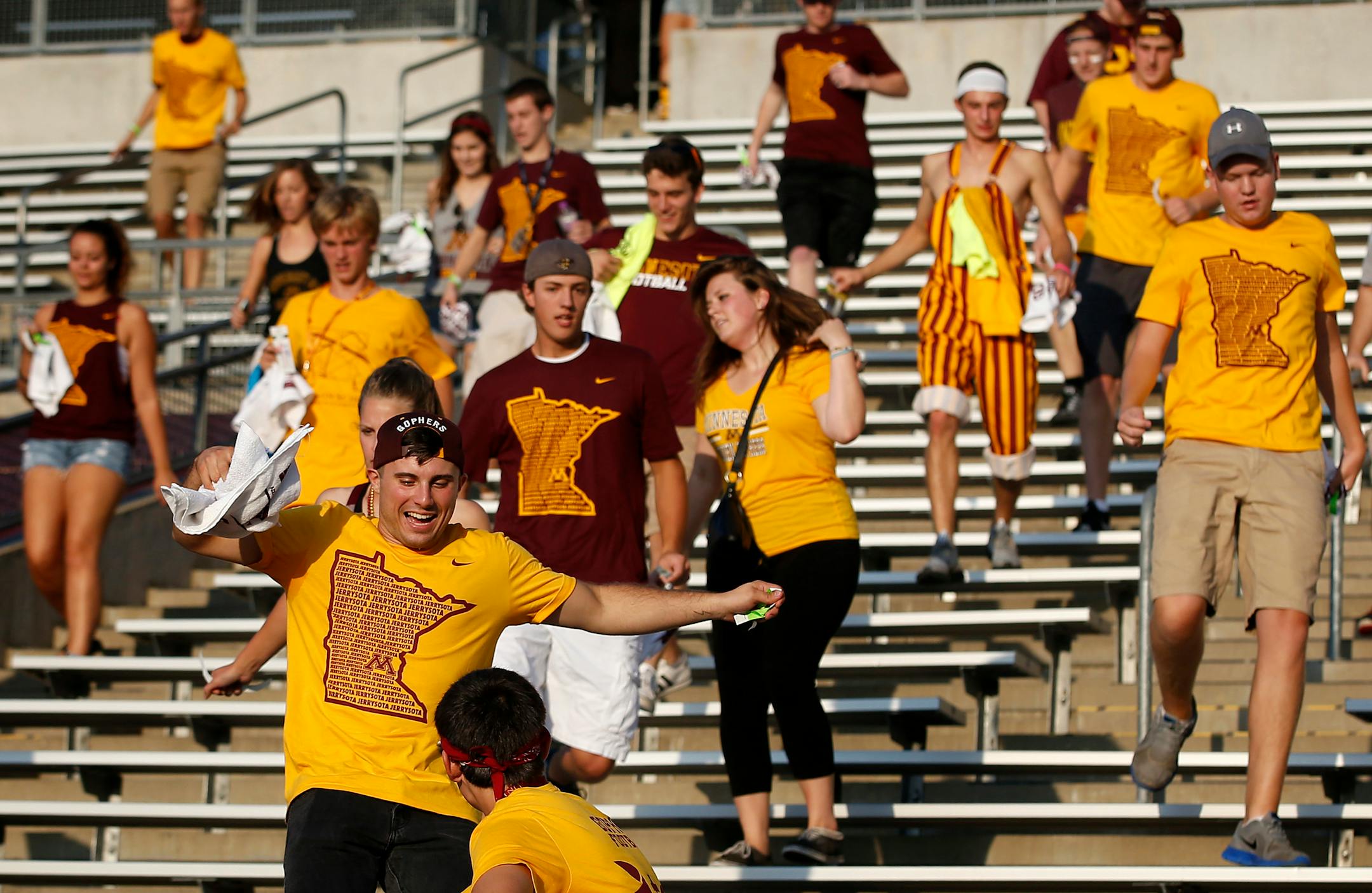 Minnesota Gophers fans scrambled to get the best seats in the student section after the doors opened at TCF Bank Stadium for Thursday night's game vs. TCU. ] CARLOS GONZALEZ cgonzalez@startribune.com - September 3, 2015, Minneapolis, MN, TCF Bank Stadium, NCAA Football, Big 10, University of Minnesota Golden Gophers vs. Texas Christian University TCU Horned Frogs