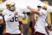Gophers punter (and holder) Mark Crawford, left, celebrated with kicker Matthew Trickett after making a practice kick a year ago in camp.