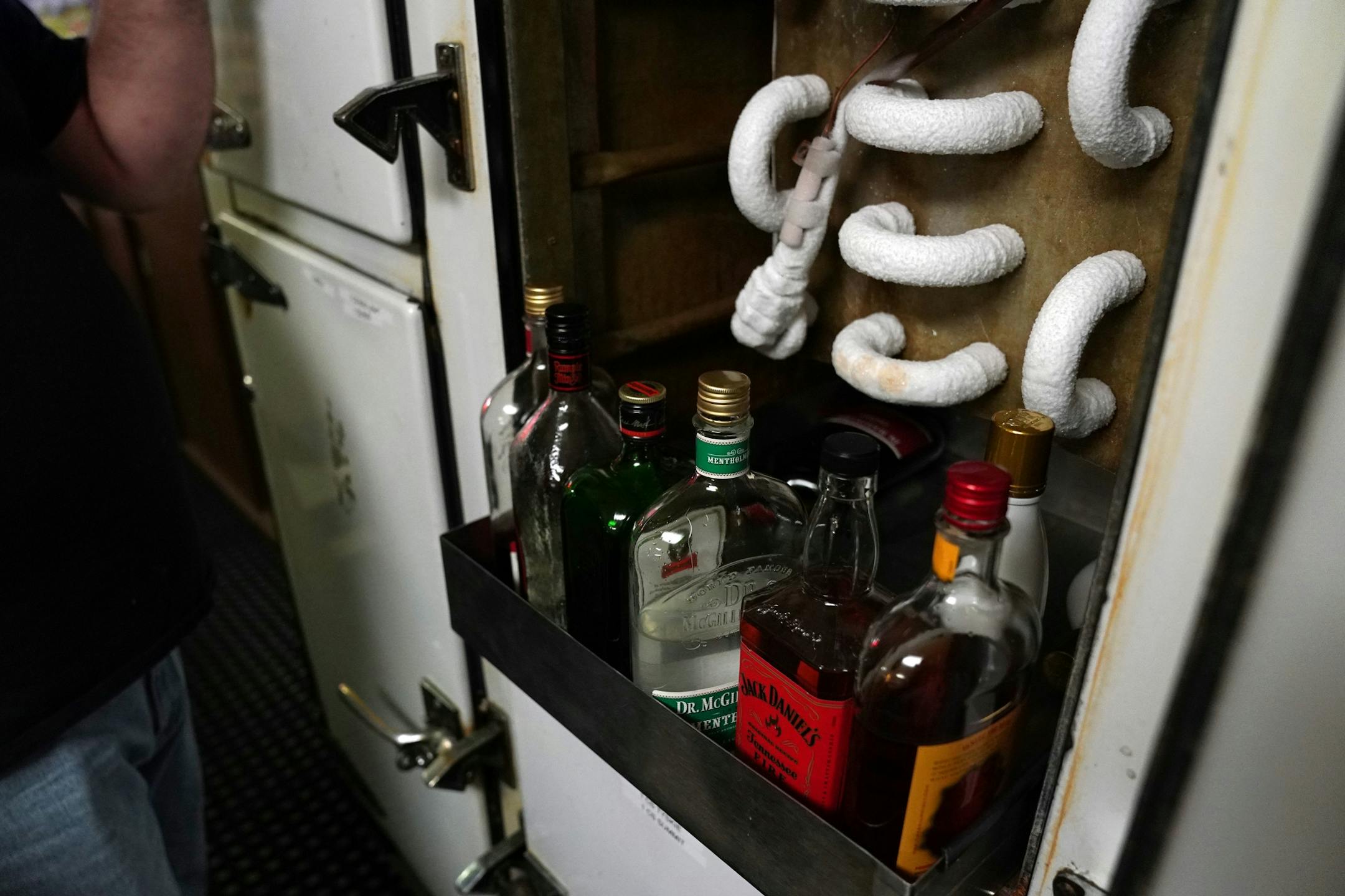 Bartender and and the National Polish Alliance outpost president Lonnie Finke showed off the alliance's original freezer, still in use, during a quiet Thursday night.