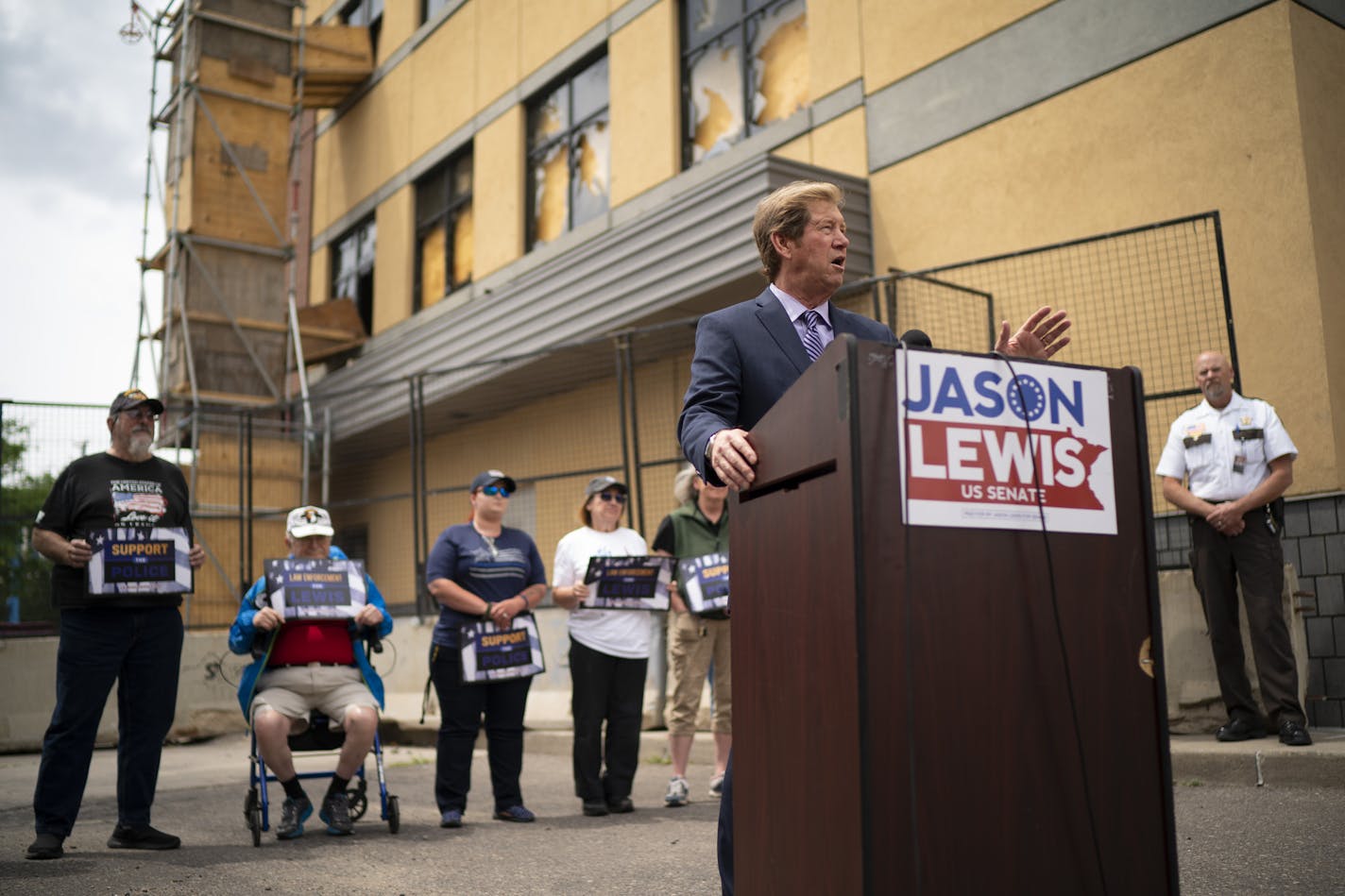 U.S. Senate candidate Jason Lewis spoke at a news conference outside the Third Precinct Police Headquarters in Minneapolis Monday afternoon. ] JEFF WHEELER • Jeff.Wheeler@startribune.com U.S. Senate candidate Jason Lewis held a "Law Enforcement for Lewis" press conference outside the former Third Precinct Police Headquarters in Minneapolis Monday afternoon, June 22, 2020. Lewis was joined by some law enforcement officers, active and retired.