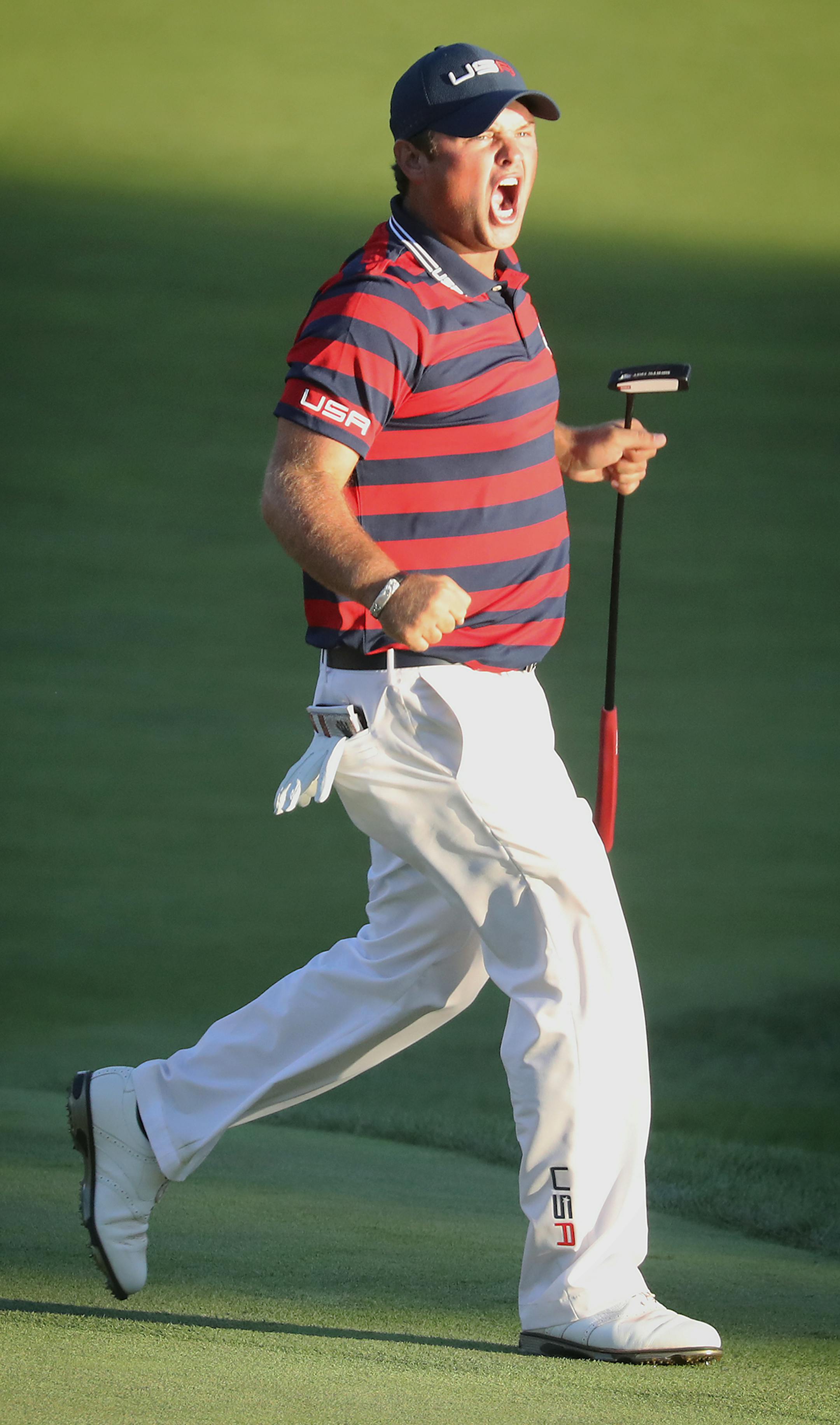 Patrick Reed sinks a putt to get a point for the USA at the 15th hole. ] (Leila Navidi/Star Tribune) leila.navidi@startribune.com BACKGROUND INFORMATION: The Ryder Cup was held on Saturday, October 1, 2016 at Hazeltine National Golf Club in Chaska, Minn.