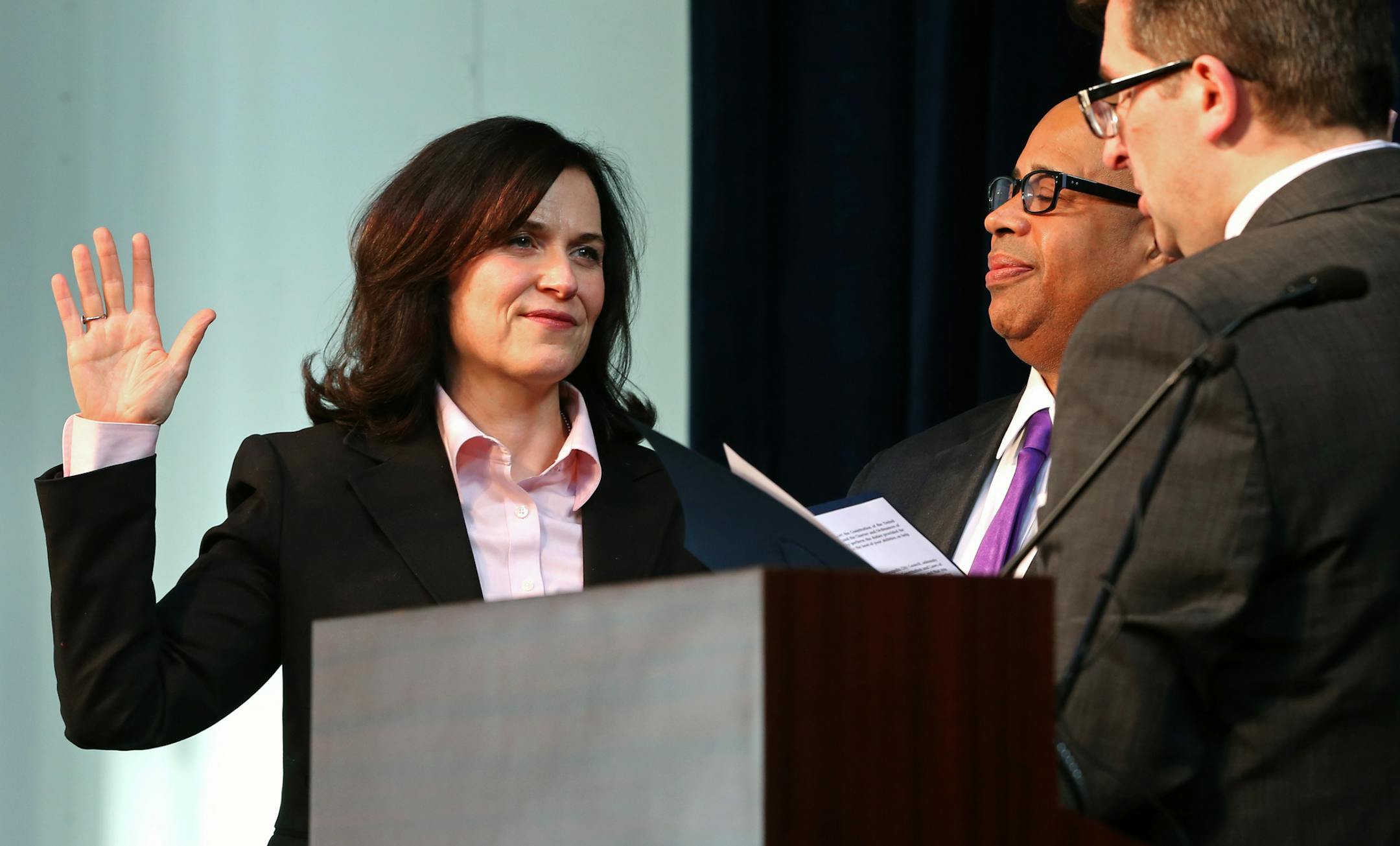 Betsy Hodges with her husband Gary Cunningham by her side, took the oath during her first swearing in ceremony at the Thorp building in North Minneapolis on 1/2/14. Several hundred friends, family and supporters attended the ceremony. Hodges' formal swearing in (where she will give her inaugural speech) is Monday, Jan. 6. Under city charter, she is required to be sworn in on the first business day of January, which is Jan. 2.] Bruce Bisping/Star Tribune bbisping@startribune.com Betsy Hodges, Gar