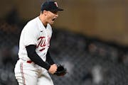 Minnesota Twins relief pitcher Griffin Jax celebrates after striking out New York Yankees first baseman Anthony Rizzo with the bases loaded to end the