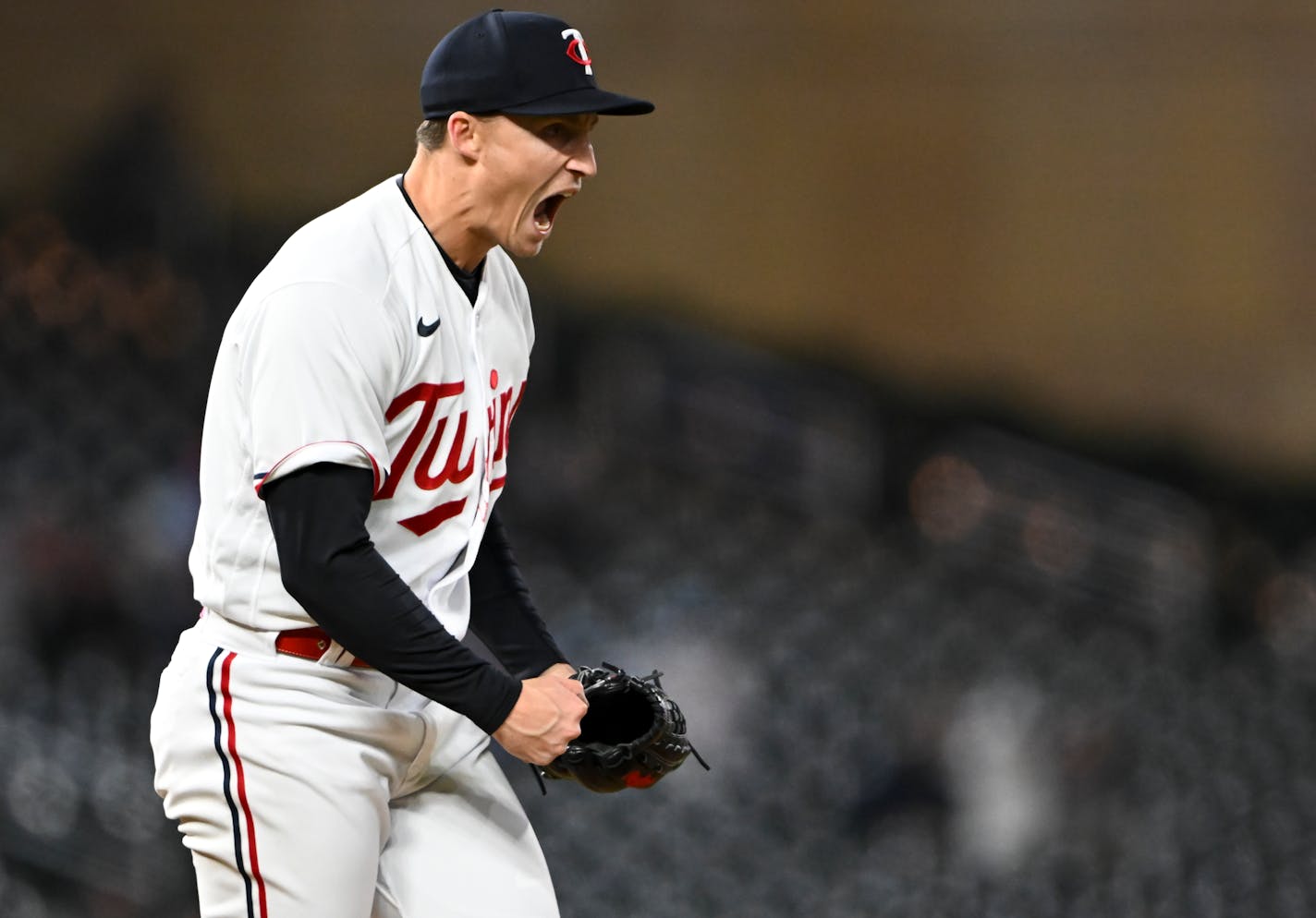 Minnesota Twins relief pitcher Griffin Jax celebrates after striking out New York Yankees first baseman Anthony Rizzo with the bases loaded to end the top of the 8th inning.