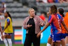 New U.S. women's national soccer team coach Emma Hayes talks to players during warmups before her debut Saturday, a 4-0 victory vs. South Korea in Com