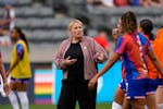 New U.S. women's national soccer team coach Emma Hayes talks to players during warmups before her debut Saturday, a 4-0 victory vs. South Korea in Com