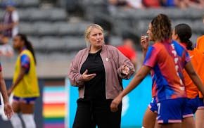 New U.S. women's national soccer team coach Emma Hayes talks to players during warmups before her debut Saturday, a 4-0 victory vs. South Korea in Com