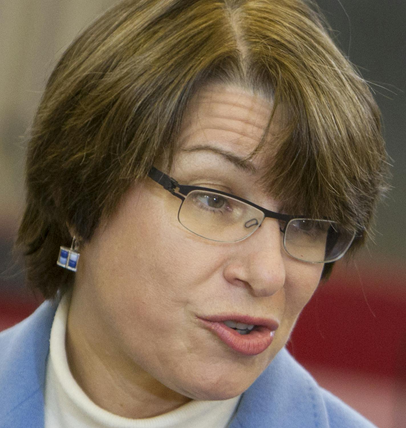 U.S. Senator Amy Klobuchar speaks to guests and media before awarding the Purple Heart to Vietnam veteran Fred Jenness after a 44-year delay at Golden Valley City Hall December 23, 2013. (Courtney Perry/Special to the Star Tribune) ORG XMIT: MIN1312231312593476