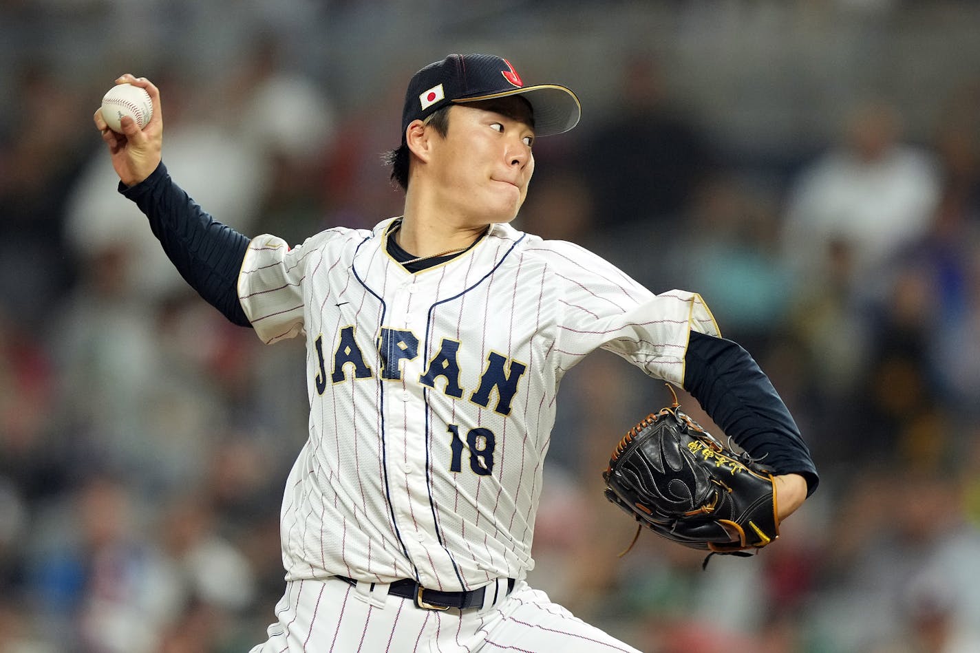 Yoshinobu Yamamoto (18) of Team Japan pitches in the eighth inning against Team Mexico during the World Baseball Classic Semifinals at loanDepot park on March 20, 2023, in Miami. (Eric Espada/Getty Images/TNS) ORG XMIT: 97228723W