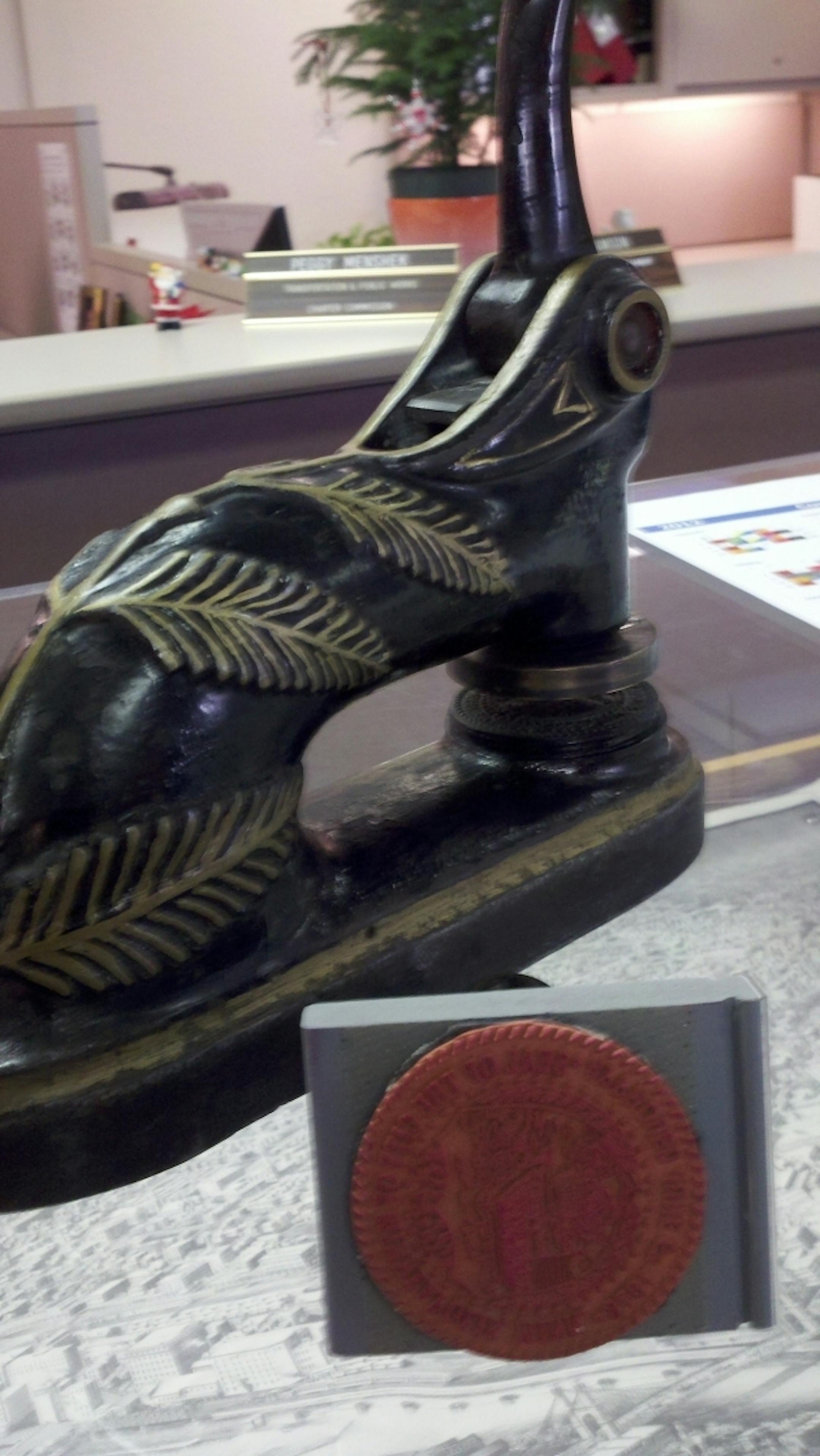 The city's embosser and its new stamper