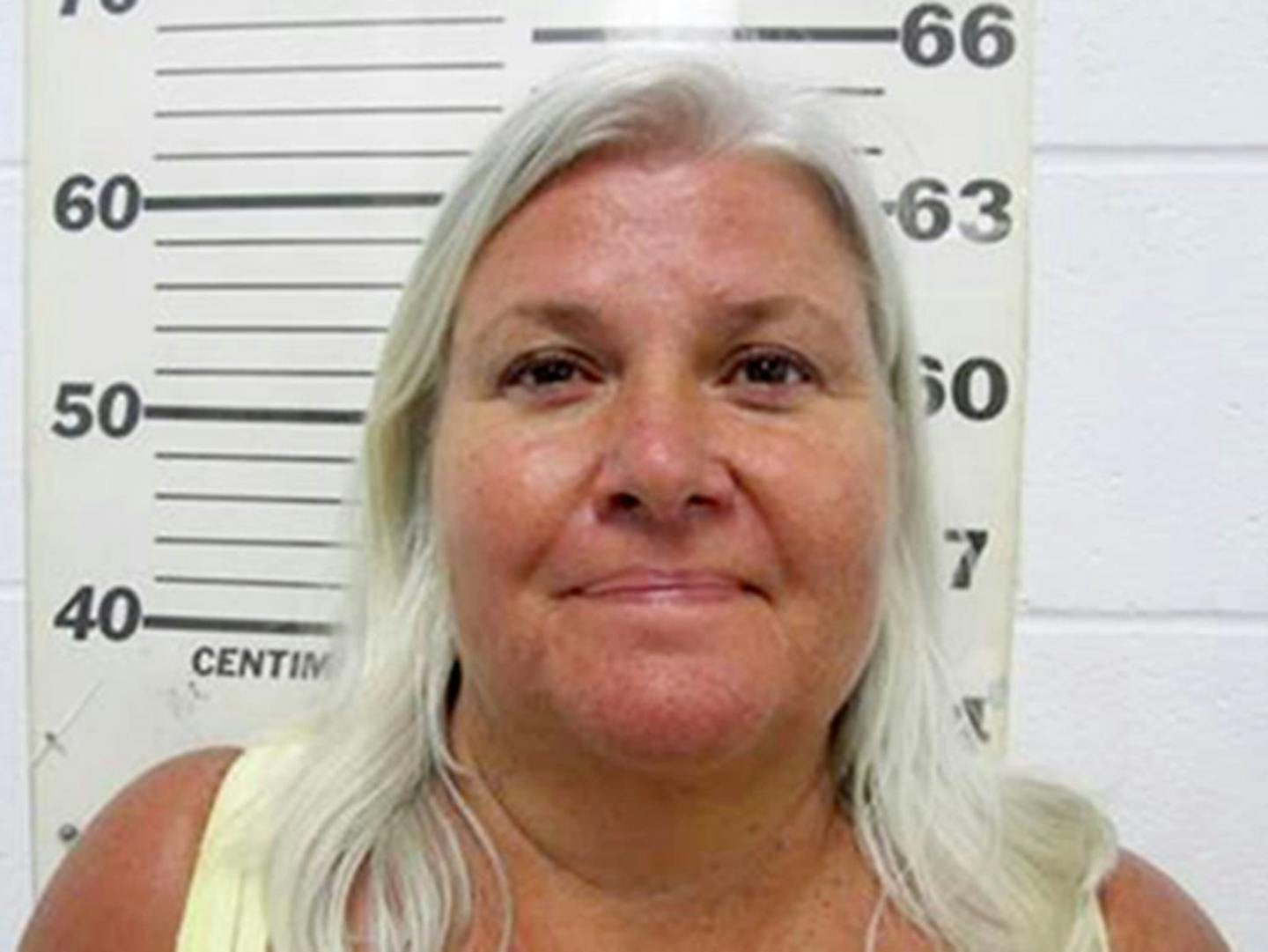 This photo provided by the South Padre Island (Texas) Police Department shows Lois Riess, of Blooming Prairie, Minn., who was arrested by federal deputy marshals Thursday, April 19, 2018.