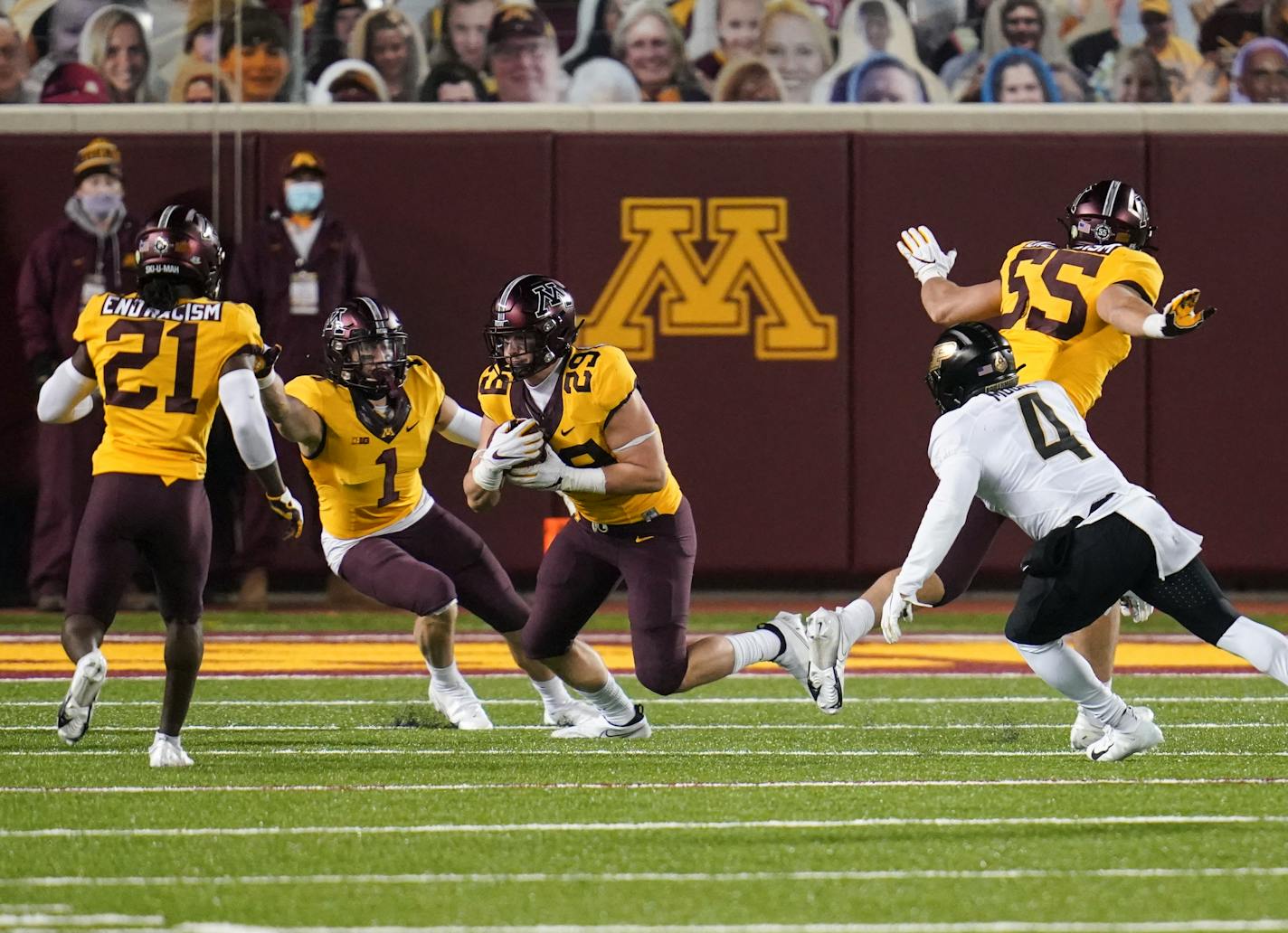 Gophers linebacker Josh Aune ran with the ball after an interception to seal Friday night's game vs. Purdue. One play earlier, the Boilermakers were flagged for offensive pass interference.