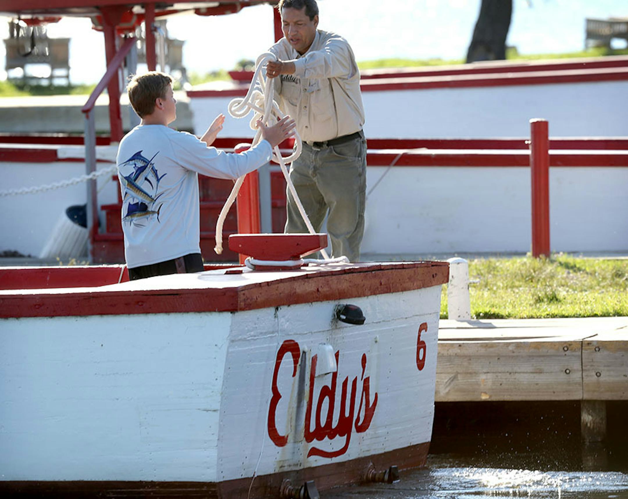 A boat from the famous Eddy's Resort, now owned by the Mille Lacs Band of Ojibwe, heads out for a fishing outing Thursday, July 30, 2015, on Lake Mille Lacs.