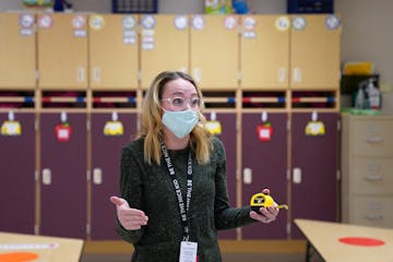 Oxbow Creek Elementary school nurse Erika Bethke measured classrooms to calculate social distancing safety requirements.