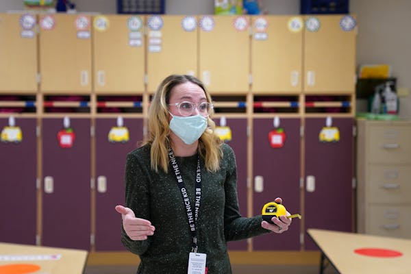 Oxbow Creek Elementary school nurse Erika Bethke measured classrooms to calculate social distancing safety requirements.