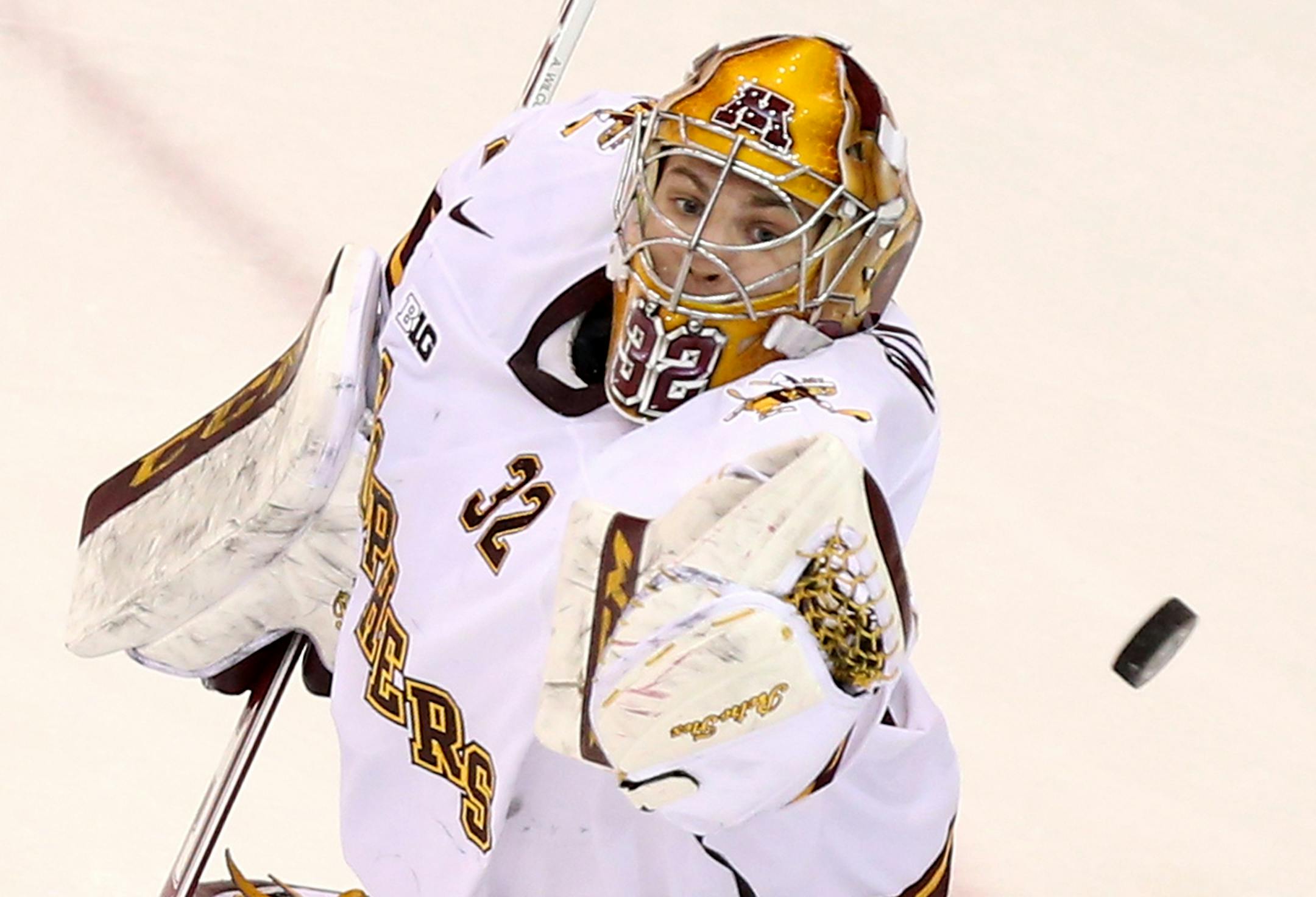 The University of Minnesota Gophers goalie Adam Wilcox knocks down a shot against Ohio State during the first period Friday, Feb. 6, 2015, at Mariucci Arena in Minneapolis, MN.