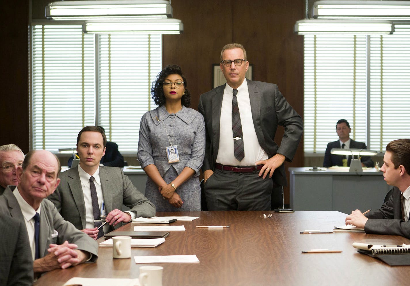 This image released by Twentieth Century Fox shows Taraji P. Henson, standing left, and Kevin Costner, standing right, in a scene from, "Hidden Figures." The film was nominated for an Oscar for best picture on Tuesday, Jan. 24, 2017. The 89th Academy Awards will take place on Feb. 26. (Hopper Stone/Twentieth Century Fox via AP) ORG XMIT: MIN2017021614551243