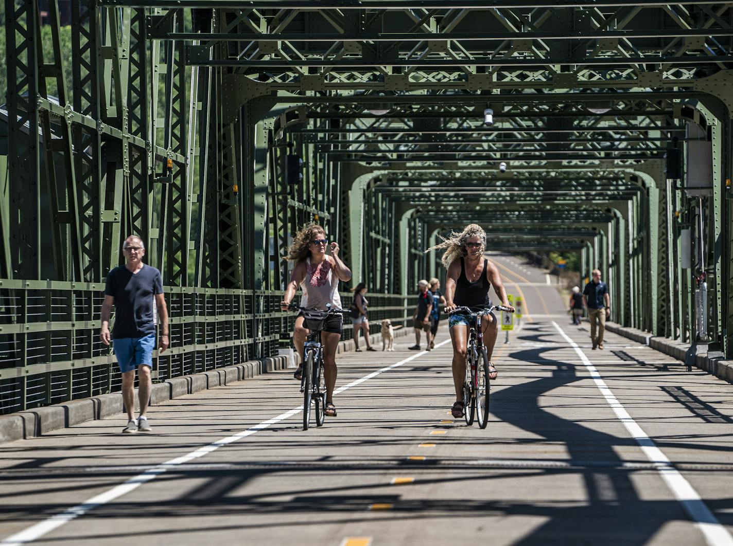 Bikers cross the historic Stillwater Lift Bridge, now exclusively for pedestrians and bikers.] Finally connected by a historic bridge and opened to the public, Stillwater's new Loop Trail has been a popular destination for cyclists and pedestrians this summer. The 4.7-mile trail that winds through Stillwater and Wisconsin carries people across the St. Croix River twic RICHARD TSONG-TAATARII ¥ richard.tsong-taatarii@startribune.com