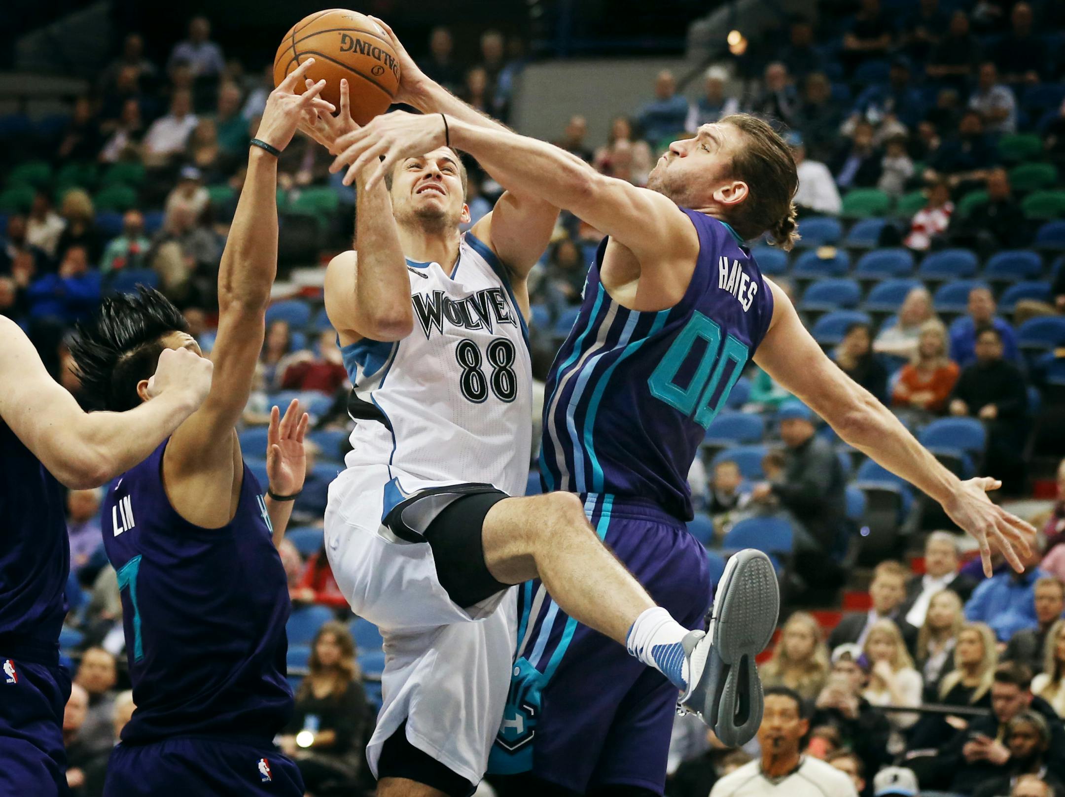 Timberwolves forward Nemanja Bjelica was fouled by Hornets forward Spencer Hawes during Charlotte's 104-91 victory at Target Center on Tuesday night.