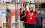 Olympic gold medal winning wrestler Gable Steveson arrives at Minneapolis-Saint Paul International Airport on Sunday, August 8, 2021.